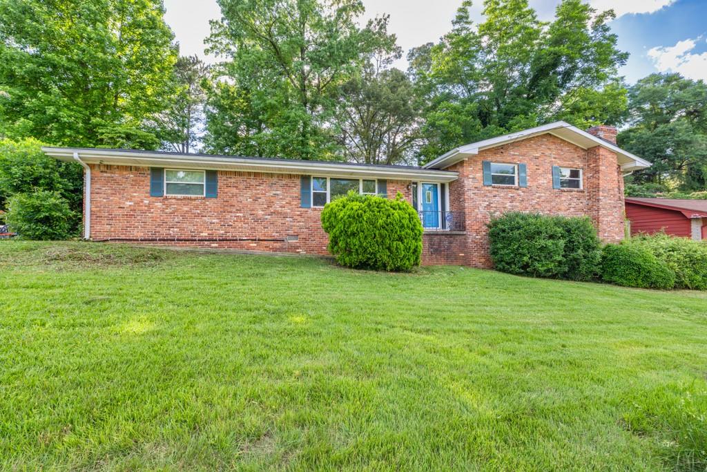 1309 Weston Drive Decatur, GA 30032 - Photo 1 of 1 a front view of a house with garden