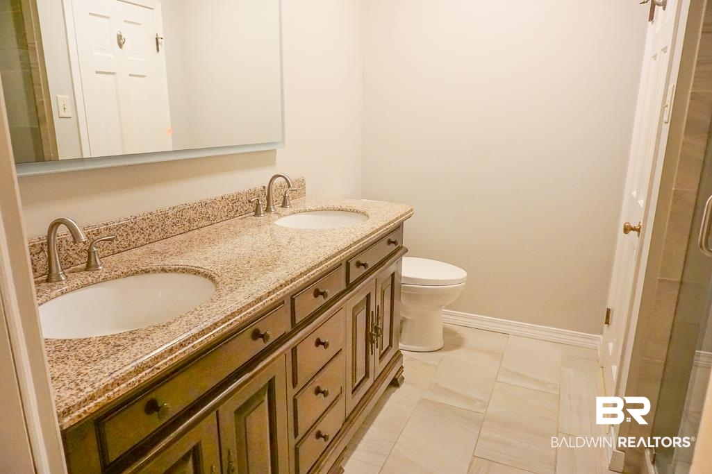 255 Suffolk Road Mobile, AL 36608 - Photo 16 of 29 Full bath featuring double vanity and a shower stall