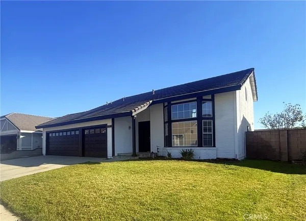 a house view with a garden space