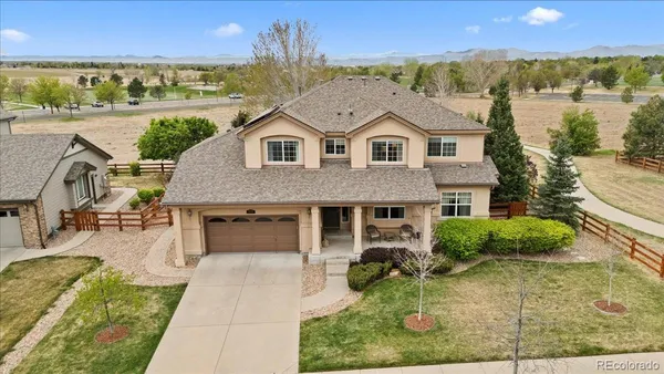 a aerial view of a house with a yard