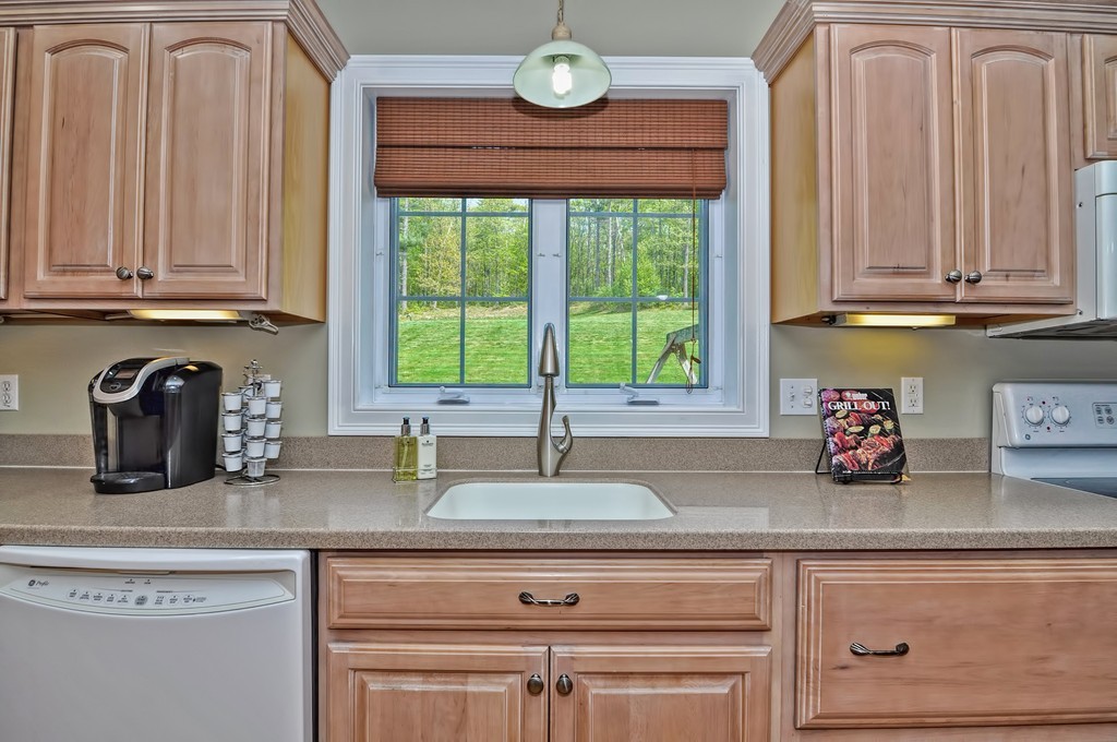 36 Proctor Road Townsend, MA 01469 - Photo 12 of 29 a kitchen with granite countertop a sink and white cabinets