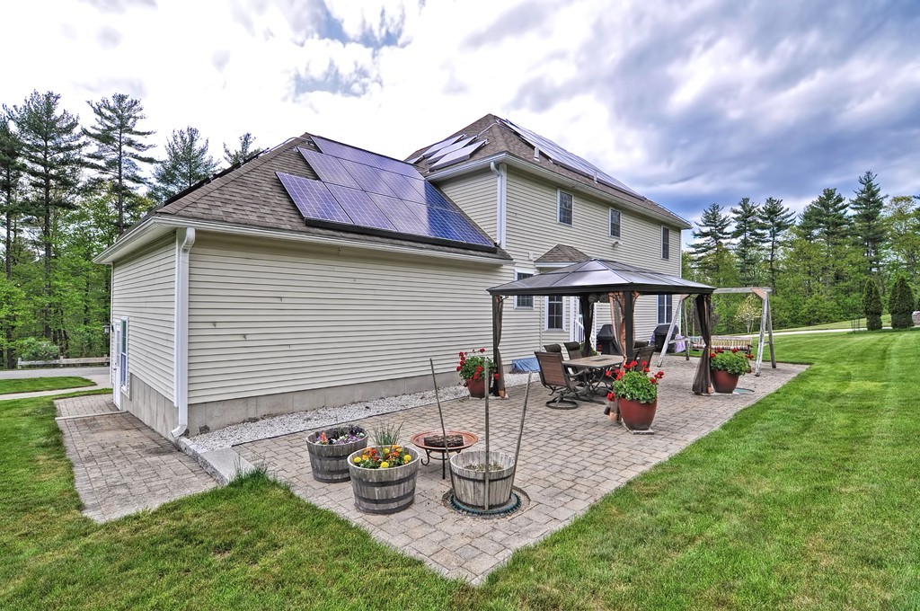 36 Proctor Road Townsend, MA 01469 - Photo 2 of 29 a view of a house with backyard sitting area and garden