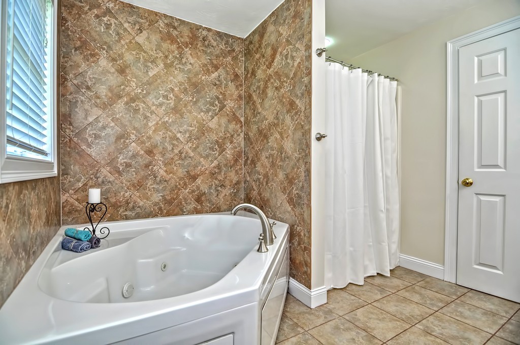 36 Proctor Road Townsend, MA 01469 - Photo 21 of 29 a bathroom with a tub and shower