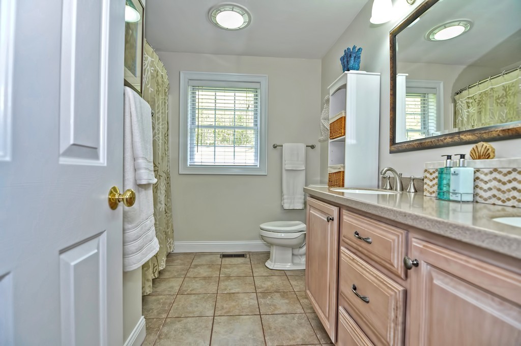 36 Proctor Road Townsend, MA 01469 - Photo 22 of 29 a bathroom with a sink a toilet and a mirror