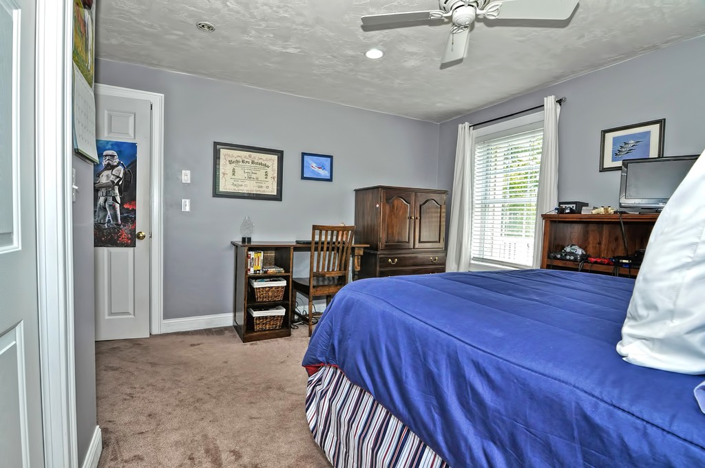 36 Proctor Road Townsend, MA 01469 - Photo 24 of 29 a bed room with a bed and a television