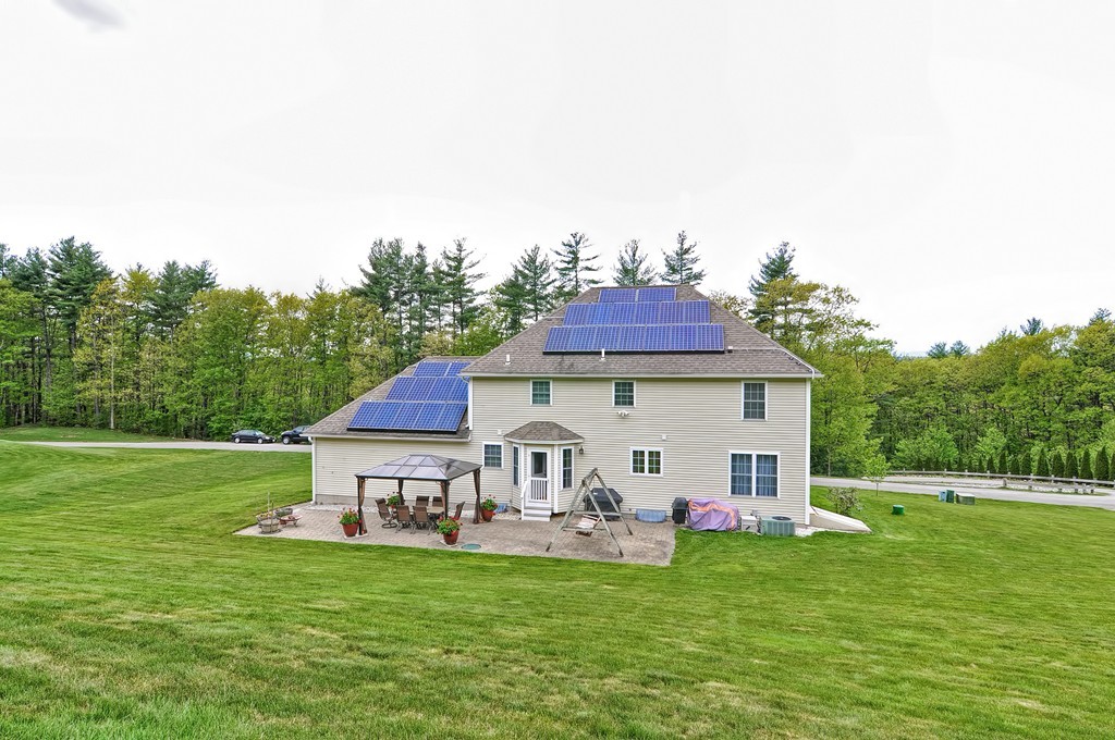 36 Proctor Road Townsend, MA 01469 - Photo 27 of 29 a view of a house with a yard and sitting area