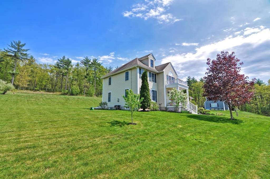 36 Proctor Road Townsend, MA 01469 - Photo 3 of 29 a front view of a house with a yard