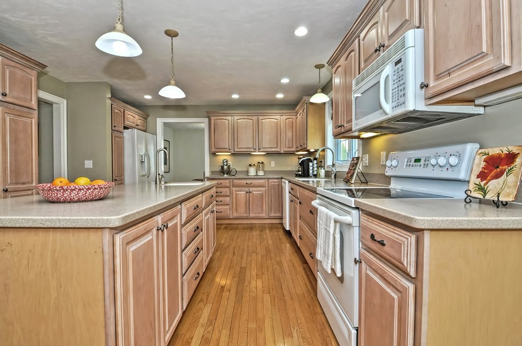36 Proctor Road Townsend, MA 01469 - Photo 9 of 29 a kitchen with stainless steel appliances granite countertop a sink and cabinets