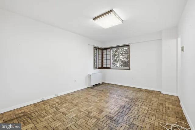 a view of an empty room with a window