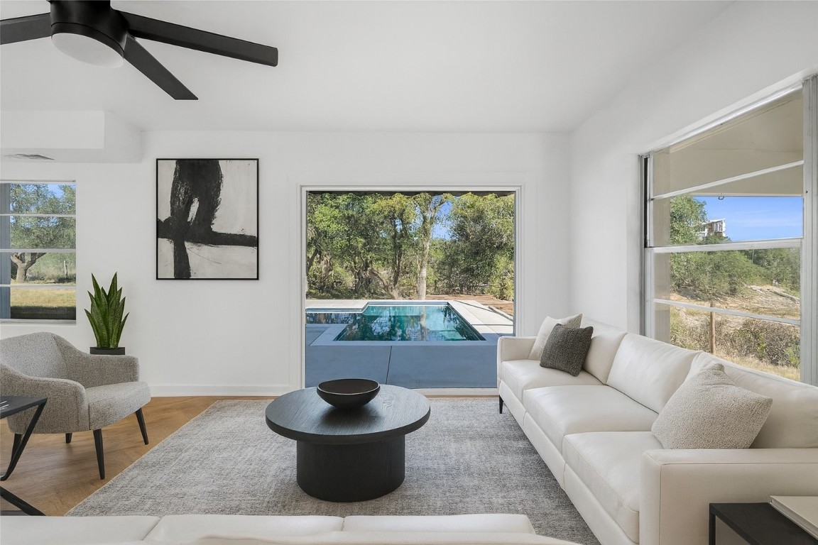 a living room with furniture and a potted plant
