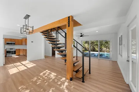 a view of entryway and hall with wooden floor