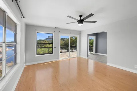 a view of an entryway with wooden floor