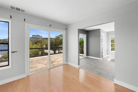 a kitchen with stainless steel appliances kitchen island granite countertop a sink and a stove