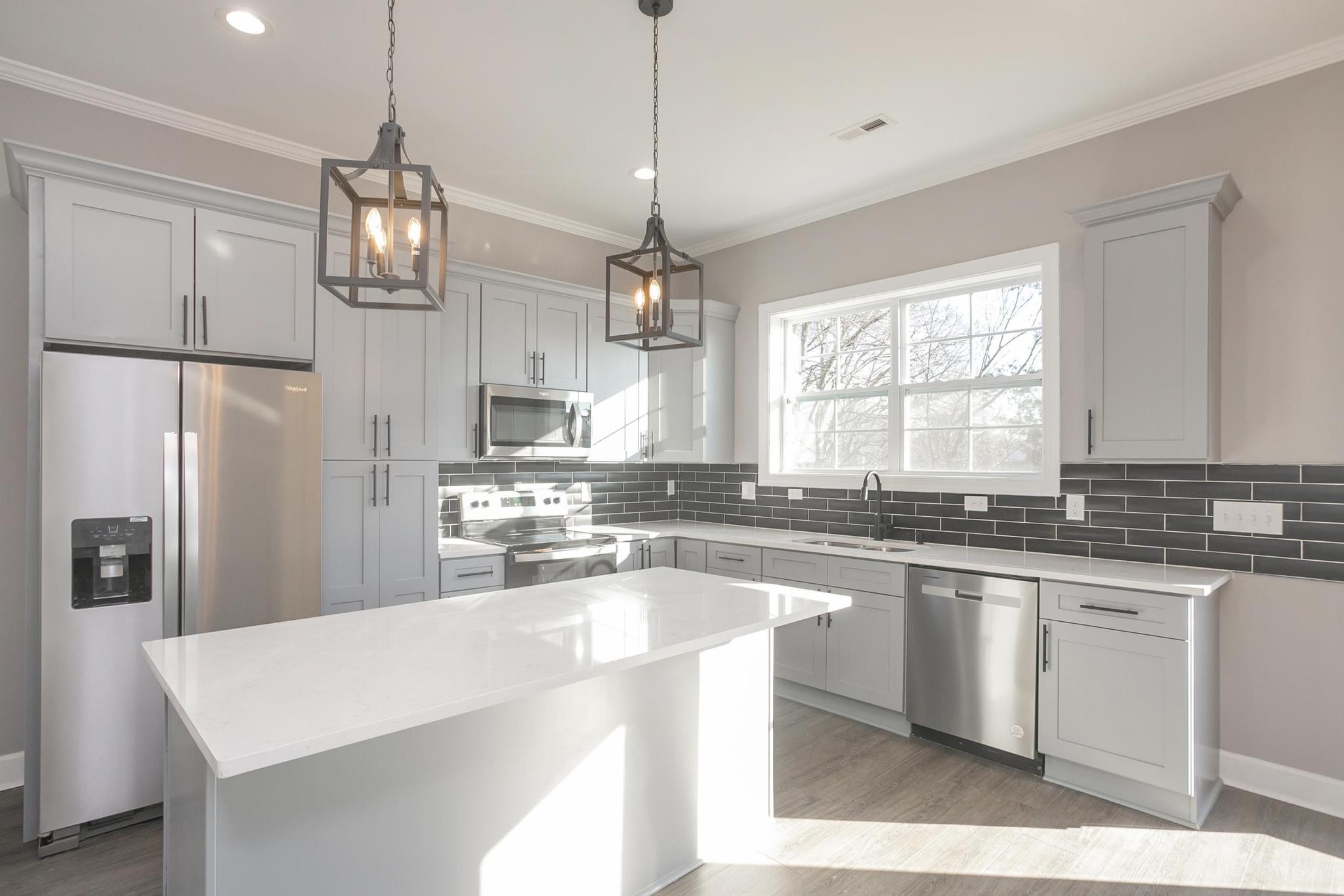 4329 Old Goins Road Nashville, TN 37211 - Photo 12 of 24 a kitchen with stainless steel appliances granite countertop a sink a stove a refrigerator a center island and cabinets