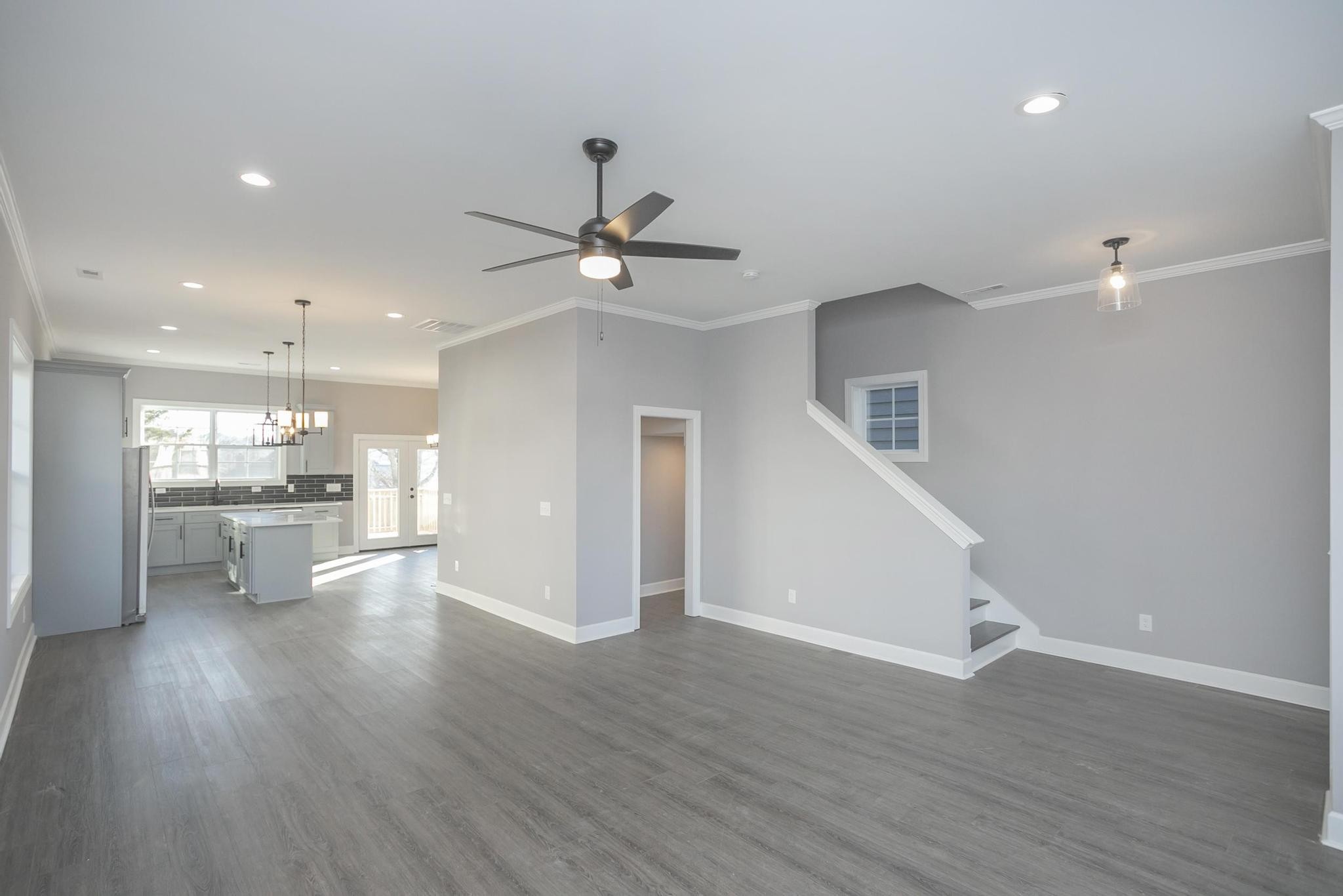 4329 Old Goins Road Nashville, TN 37211 - Photo 7 of 24 a view of an empty room and kitchen view with wooden floor