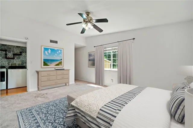 a bedroom with a bed and cabinets