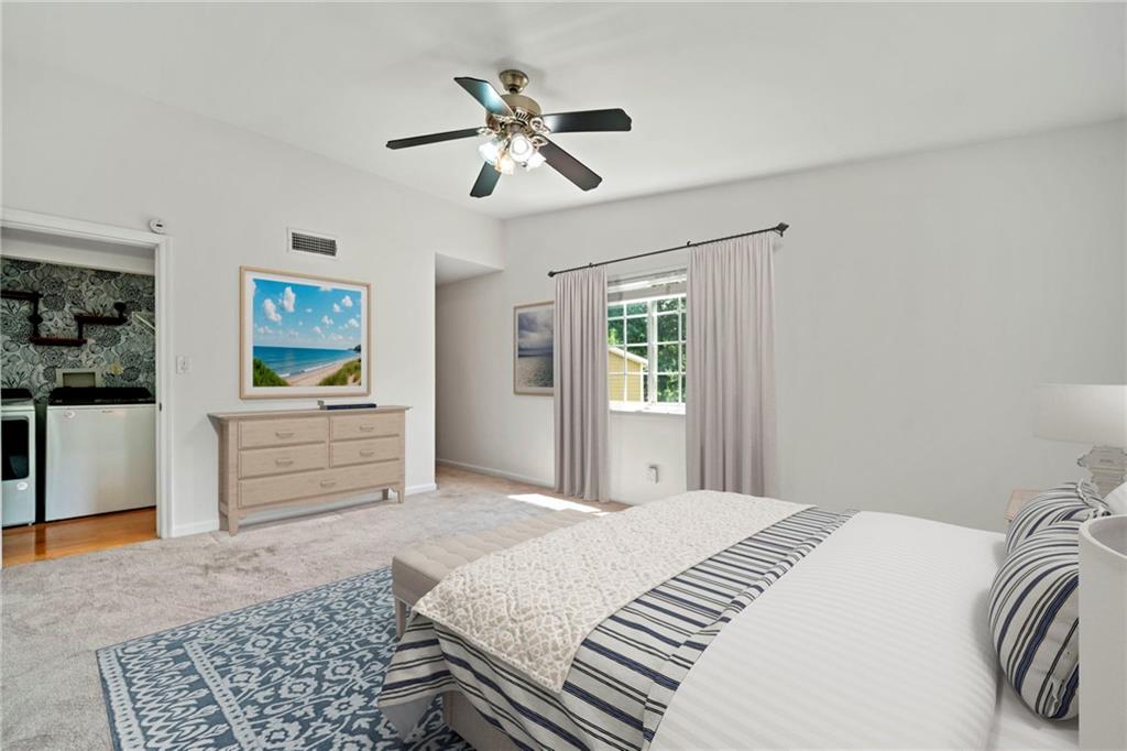 1468 Briarwood Road Northeast, Unit 108 Atlanta, GA 30319 - Photo 13 of 33 a bedroom with a bed and cabinets