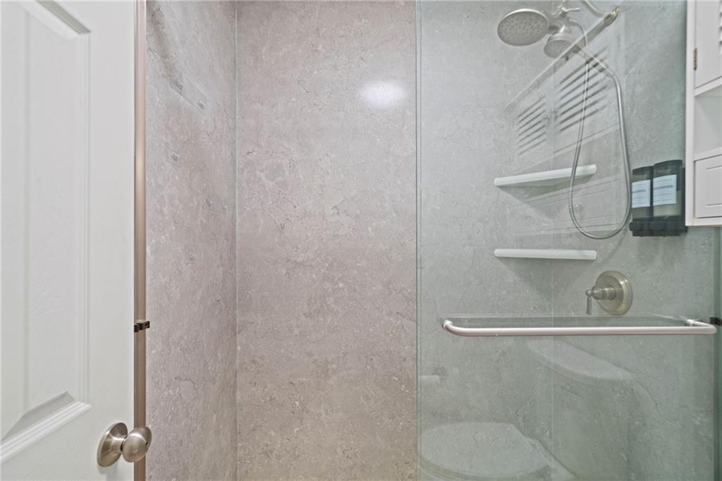 1468 Briarwood Road Northeast, Unit 108 Atlanta, GA 30319 - Photo 18 of 33 a bathroom with a shower