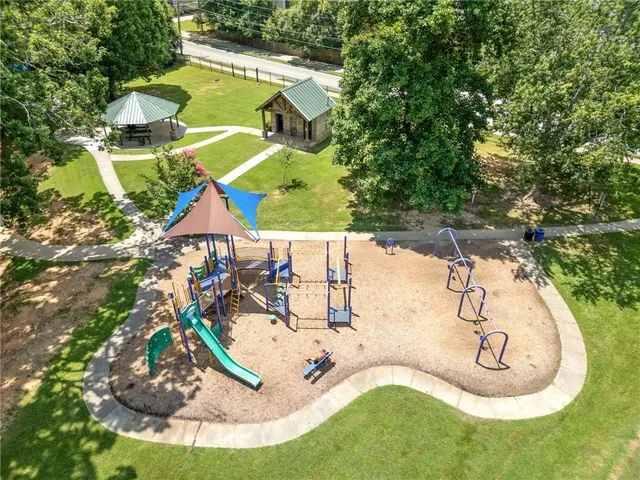 a view of a swimming pool with a yard