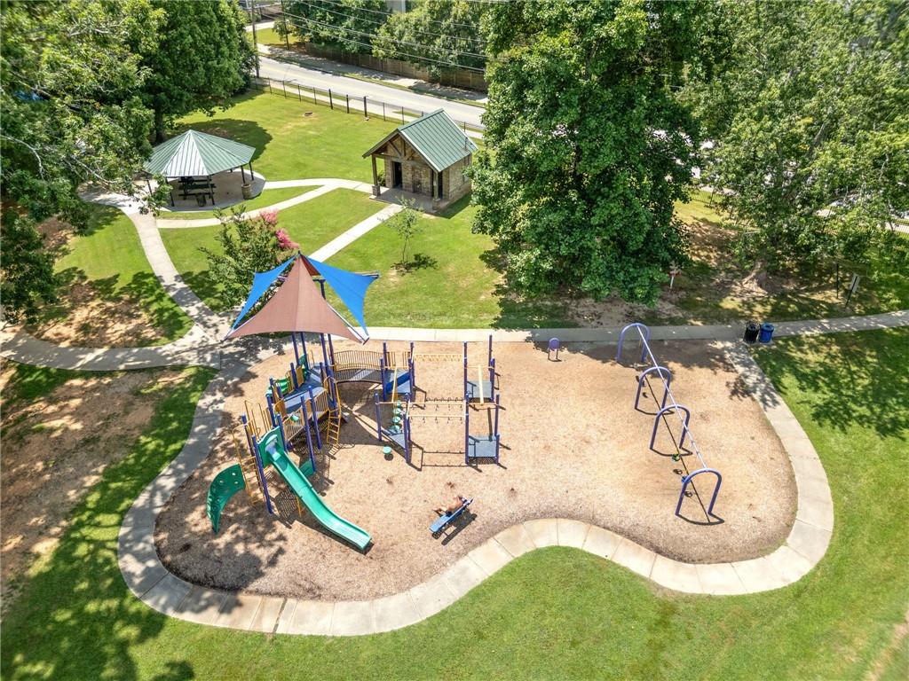 1468 Briarwood Road Northeast, Unit 108 Atlanta, GA 30319 - Photo 25 of 33 a view of a swimming pool with a yard