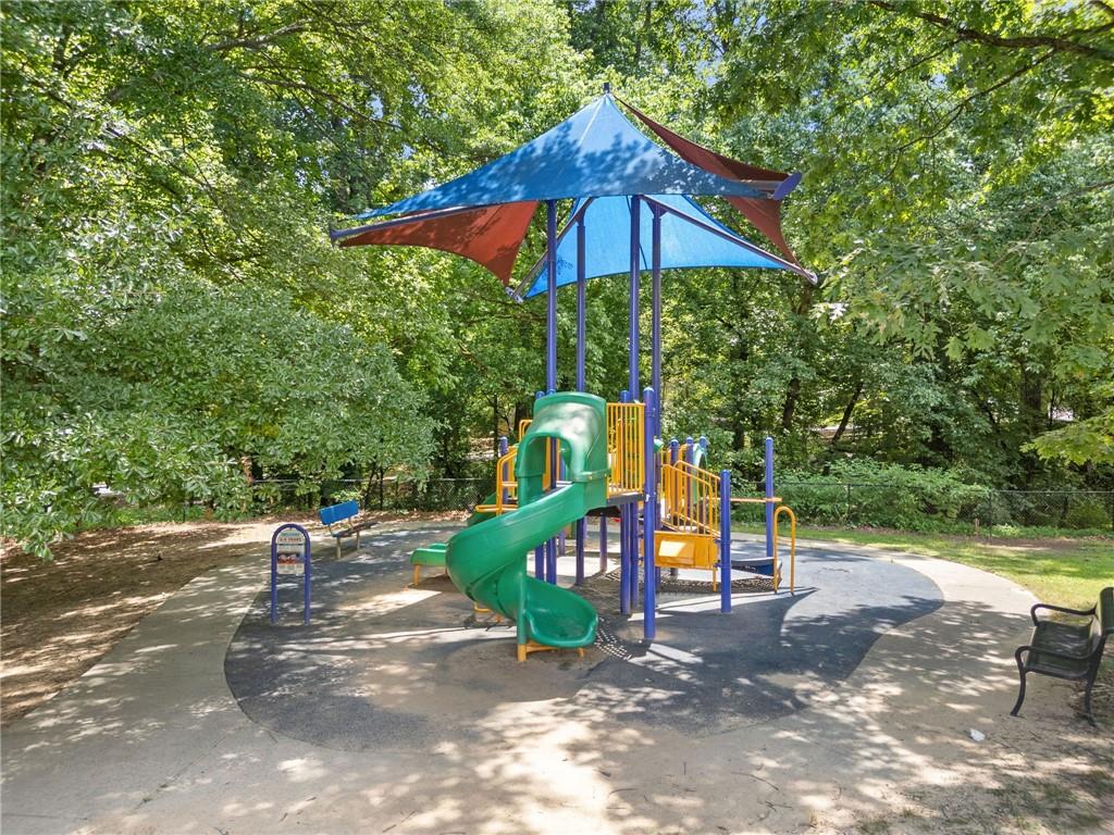 1468 Briarwood Road Northeast, Unit 108 Atlanta, GA 30319 - Photo 26 of 33 a view of outdoor space with playground and green space