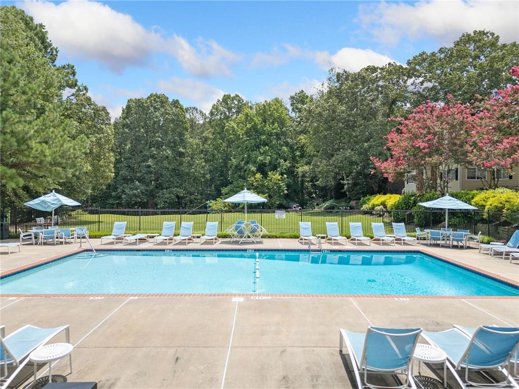 1468 Briarwood Road Northeast, Unit 108 Atlanta, GA 30319 - Photo 28 of 33 a view of a swimming pool and lounge chairs