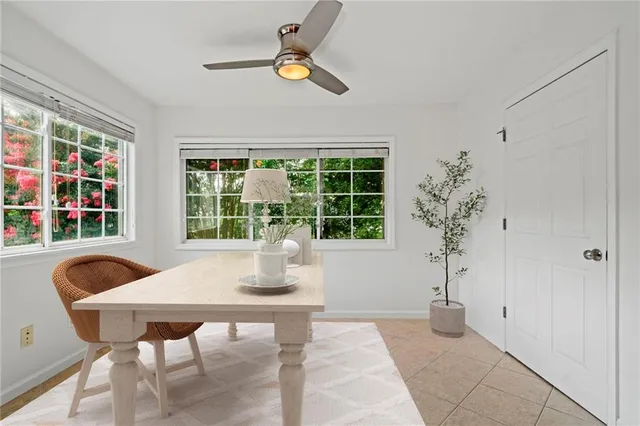 a view of a dining room with furniture window and outside view