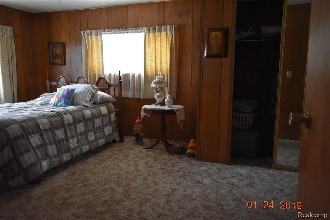 1505 West Hibbard Road Owosso, MI 48867 - Photo 9 of 13 master bedroom.jpg