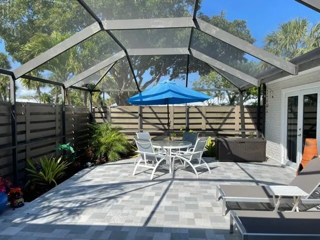 a patio with a table and chairs
