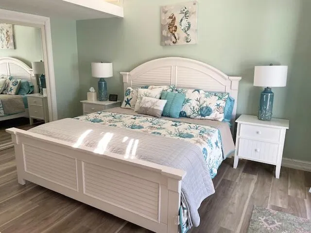 a bedroom with a bed and a table