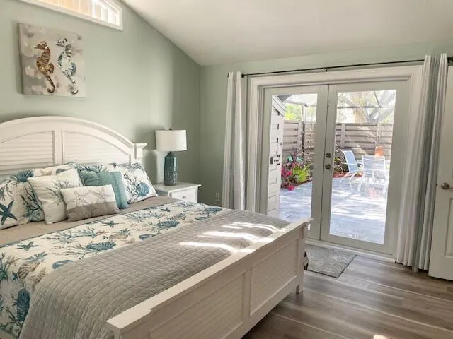 a bedroom with a large bed and a window