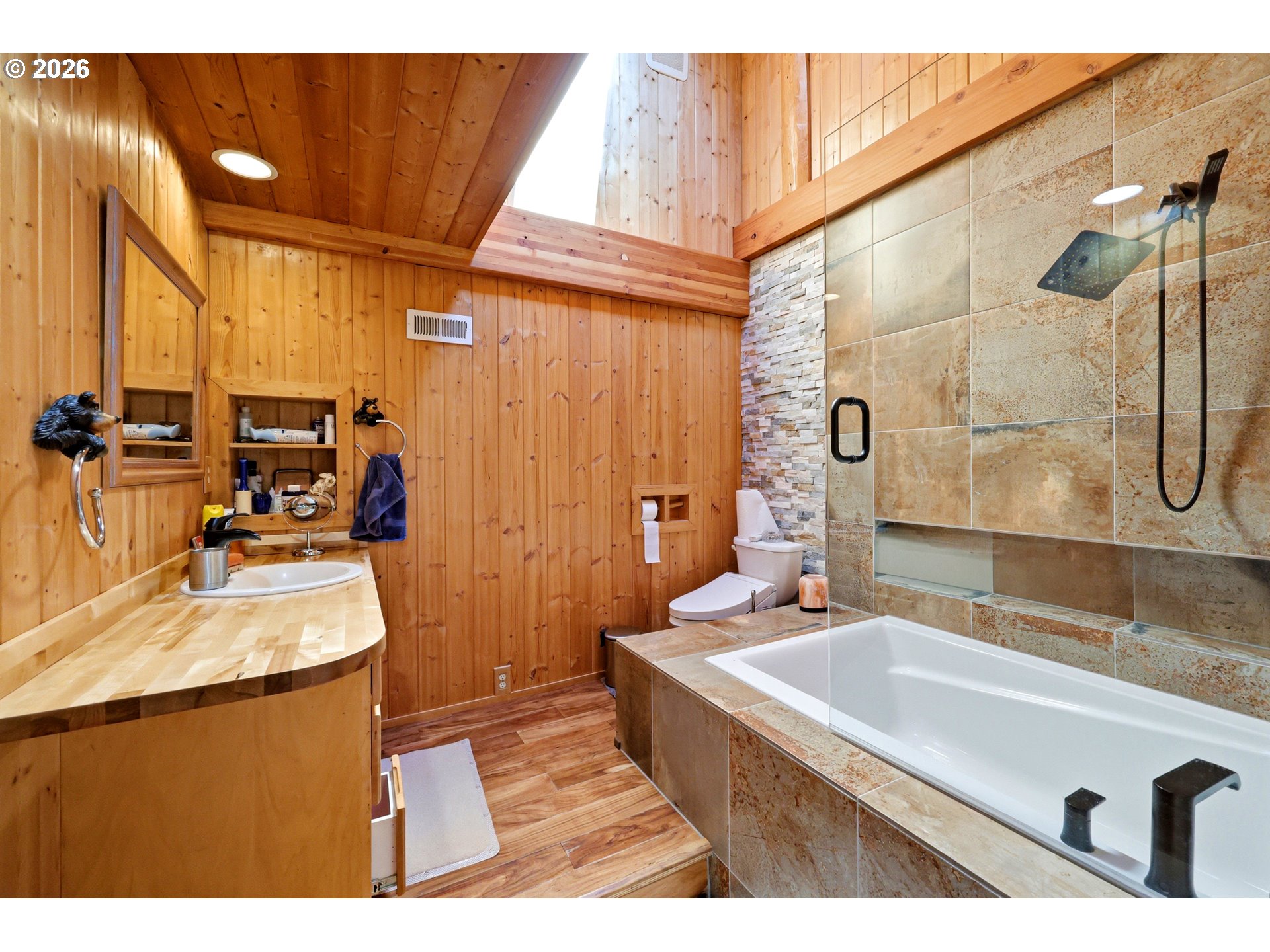 390 Spruce Creek Road Longview, WA 98632 - Photo 34 of 45 a bathroom with a sink vanity granite tub shower and a mirror