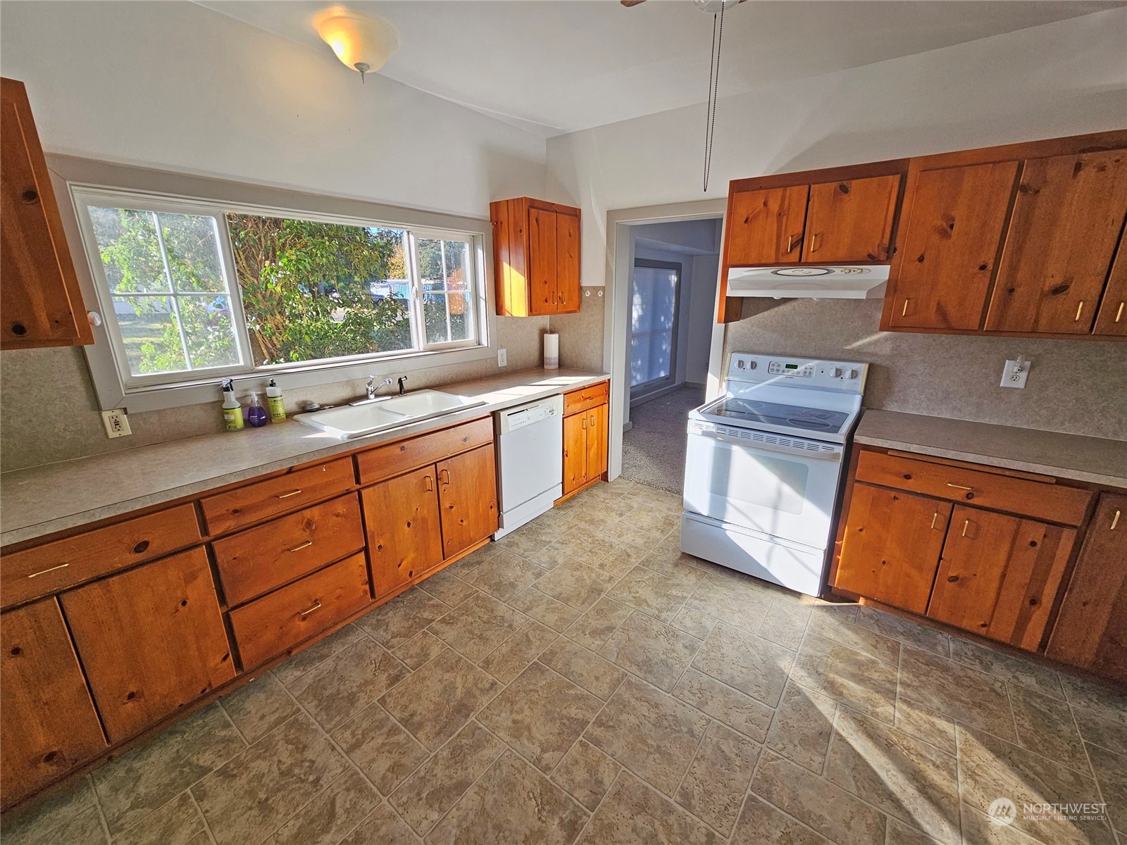 18220 Dallas Street Southwest Rochester, WA 98579 - Photo 5 of 28 a kitchen with stainless steel appliances granite countertop a sink stove and cabinets