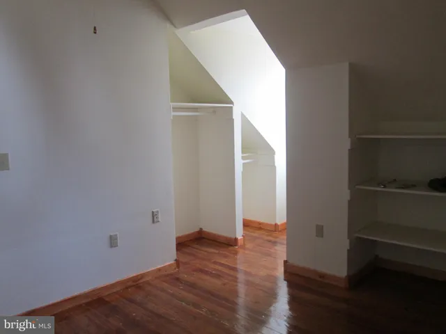 a bathroom with a shower and toilet
