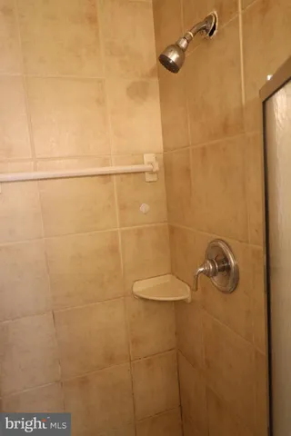 a kitchen with granite countertop a sink stove and cabinets