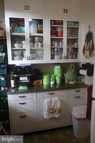 a kitchen with a table and chairs