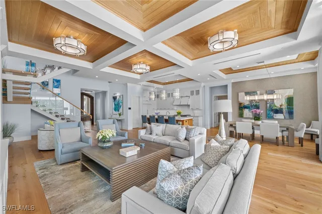 a living room with furniture and a clock