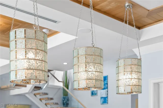 a room with window and chandelier