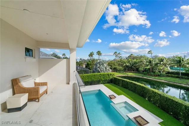 a spacious bedroom with a bed and a large window