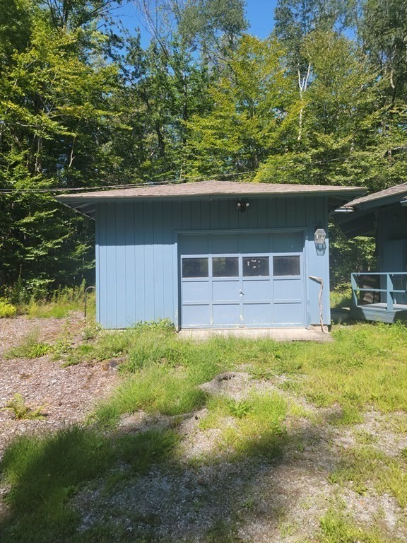 141 Fox Den Road Tolland, MA 01034 - Photo 2 of 7 a house with a tree in the background