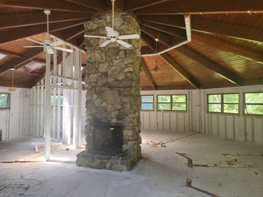 141 Fox Den Road Tolland, MA 01034 - Photo 3 of 7 a view of a porch with a wooden fence