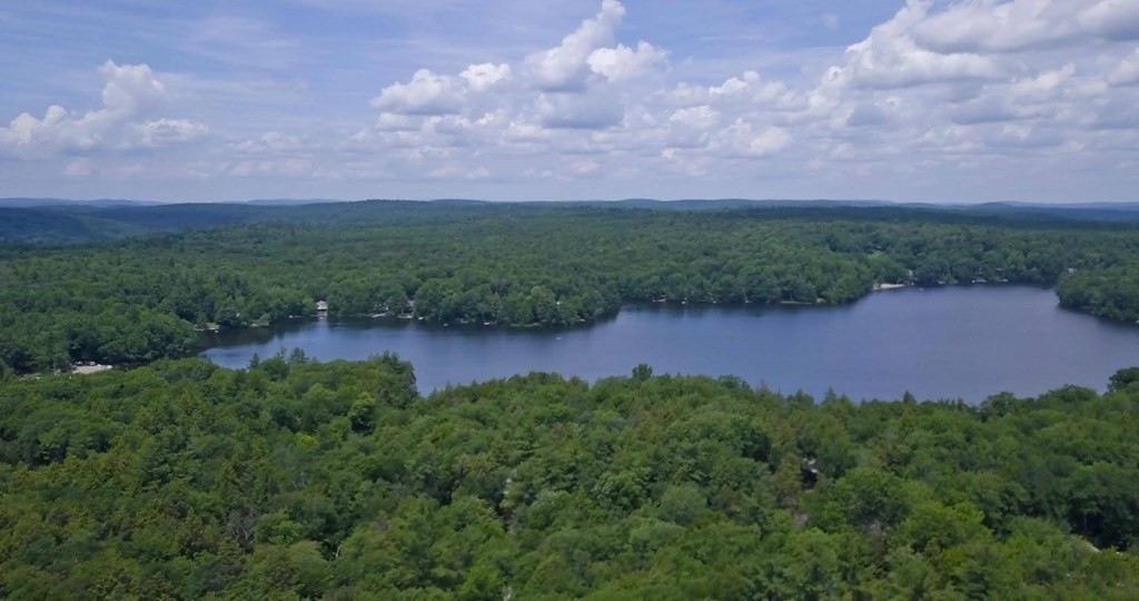 141 Fox Den Road Tolland, MA 01034 - Photo 5 of 7 a view of a lake and a yard