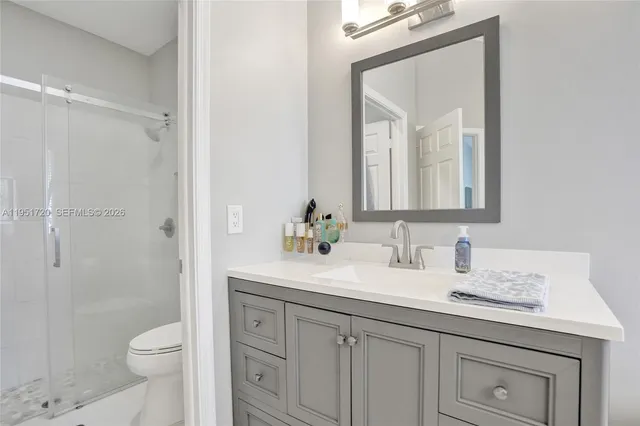 a living room with furniture and large windows