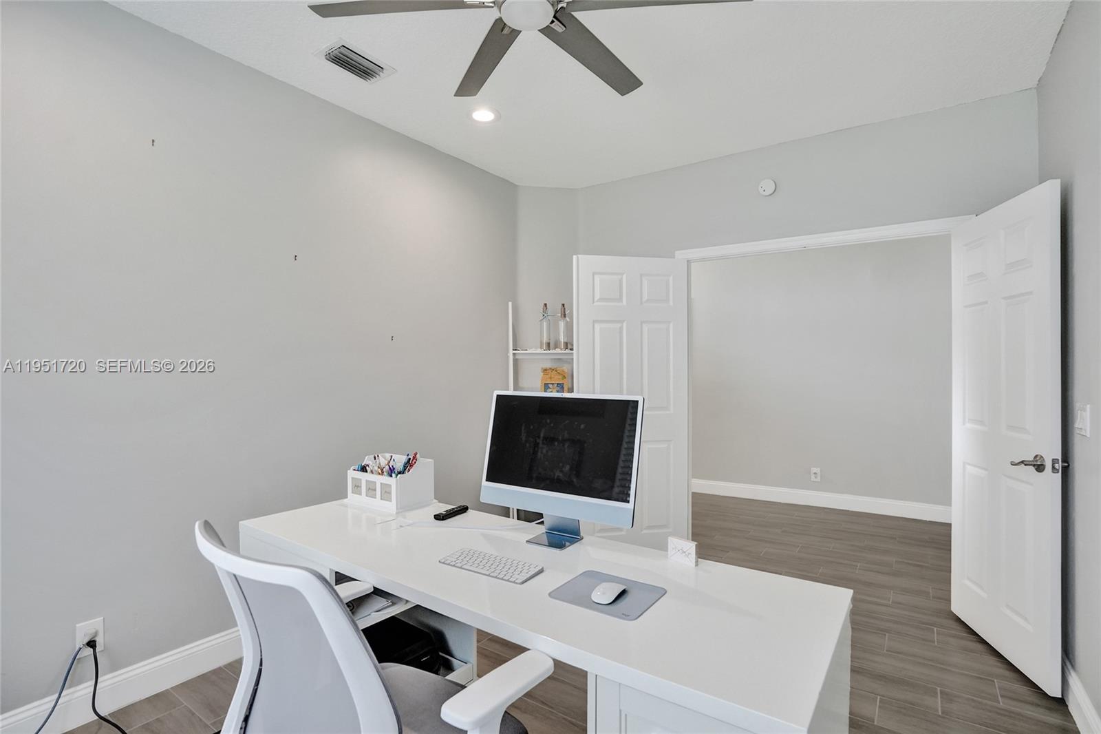 8795 Northwest 76th Place Tamarac, FL 33321 - Photo 24 of 69 a view of a workspace with furniture
