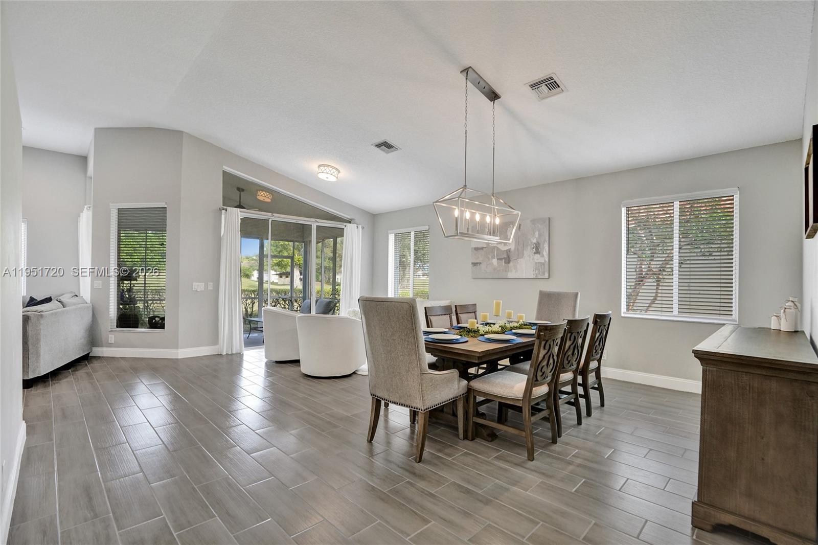 8795 Northwest 76th Place Tamarac, FL 33321 - Photo 5 of 69 a view of a dining room with furniture window and outside view