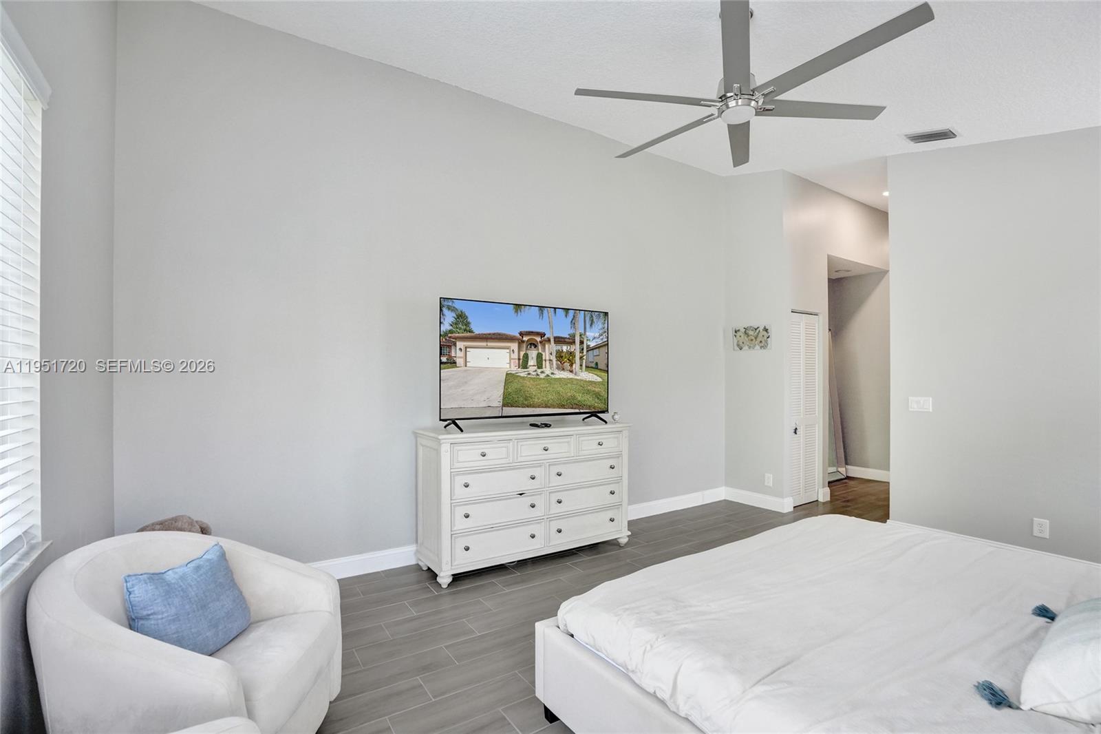 8795 Northwest 76th Place Tamarac, FL 33321 - Photo 54 of 69 a bedroom with a bed and a dresser