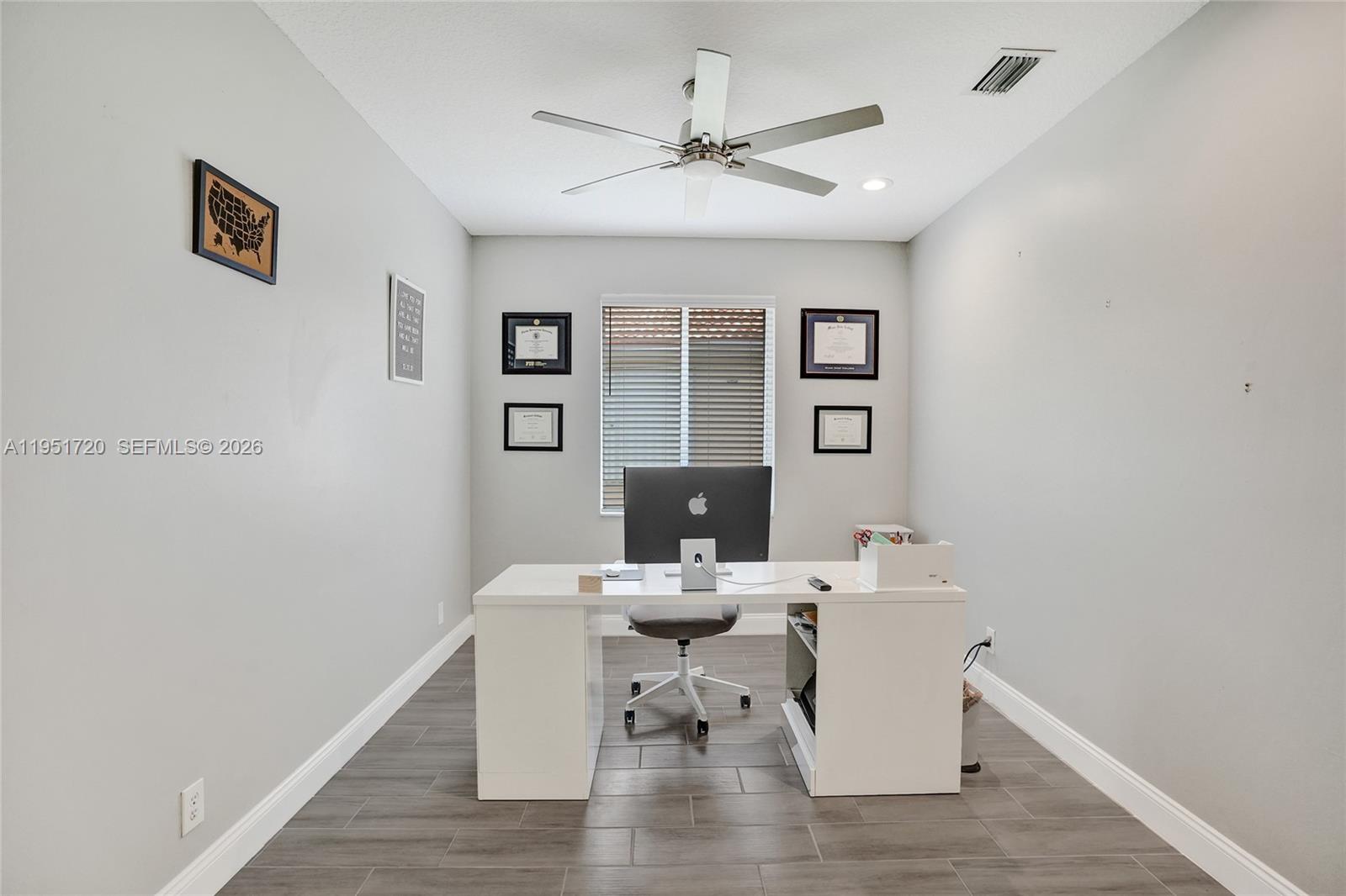 8795 Northwest 76th Place Tamarac, FL 33321 - Photo 58 of 69 a view of a dining room with furniture window and wooden floor