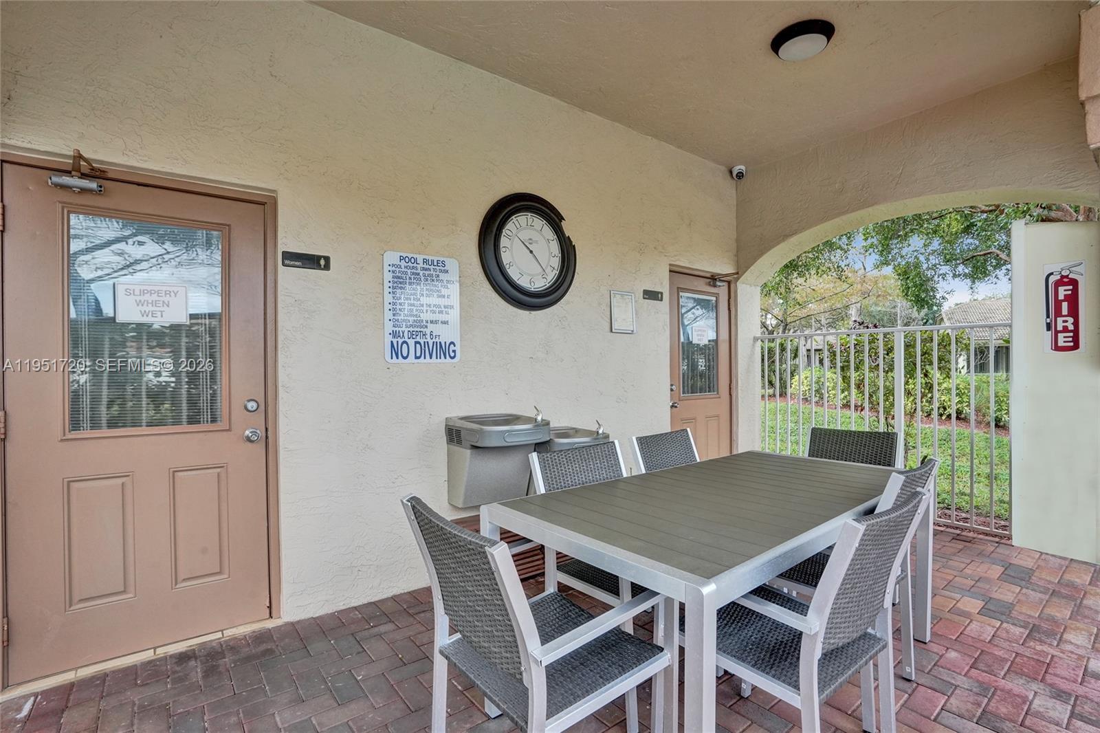 8795 Northwest 76th Place Tamarac, FL 33321 - Photo 68 of 69 a view of a dining room with furniture window and outside view