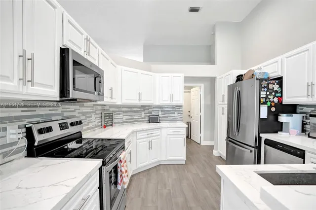 a view of a workspace with furniture