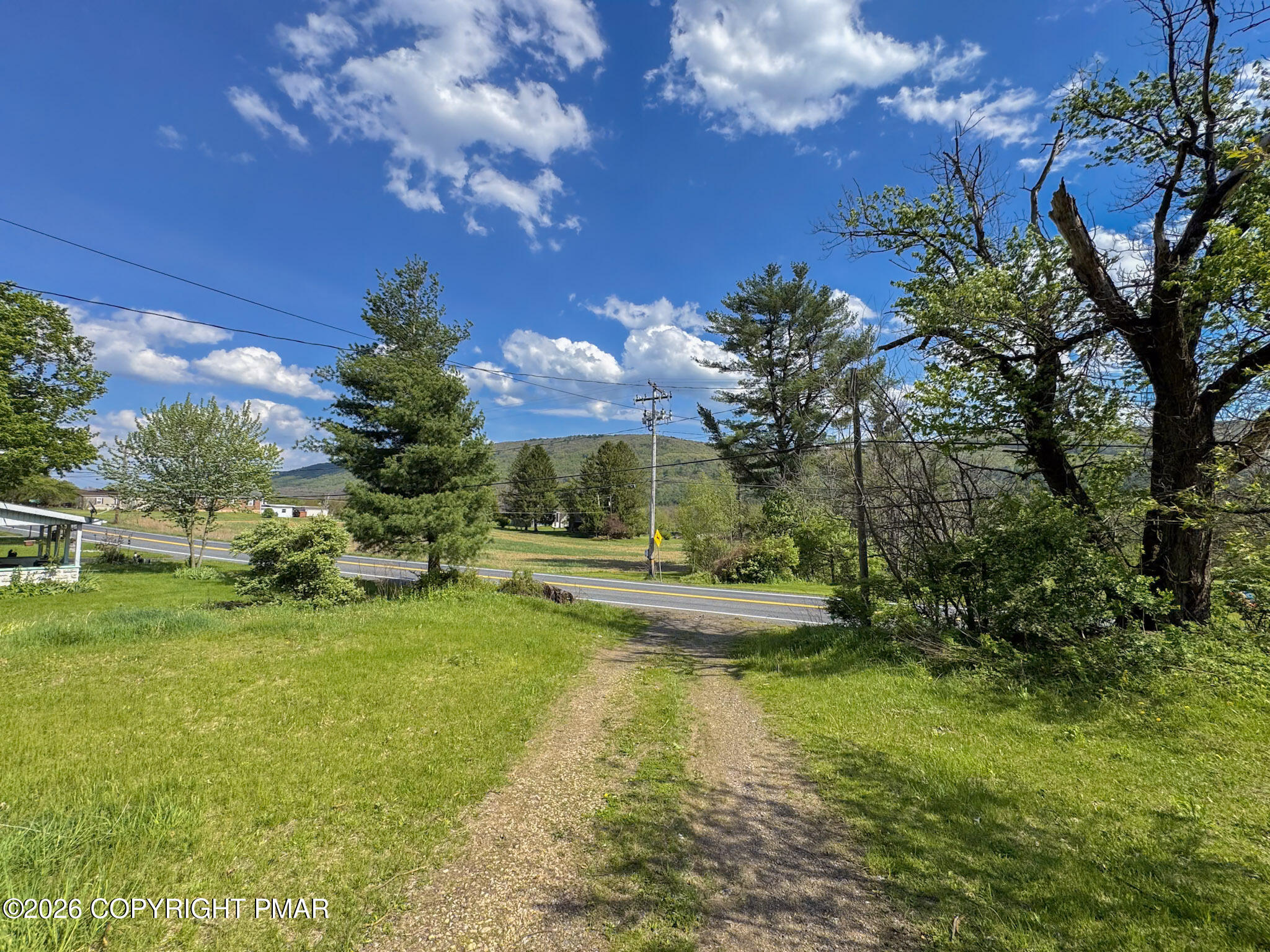 279 East Lizard Creek Road Lehighton, PA 18235 - Photo 22 of 25 a view of a house with swimming pool next to a yard